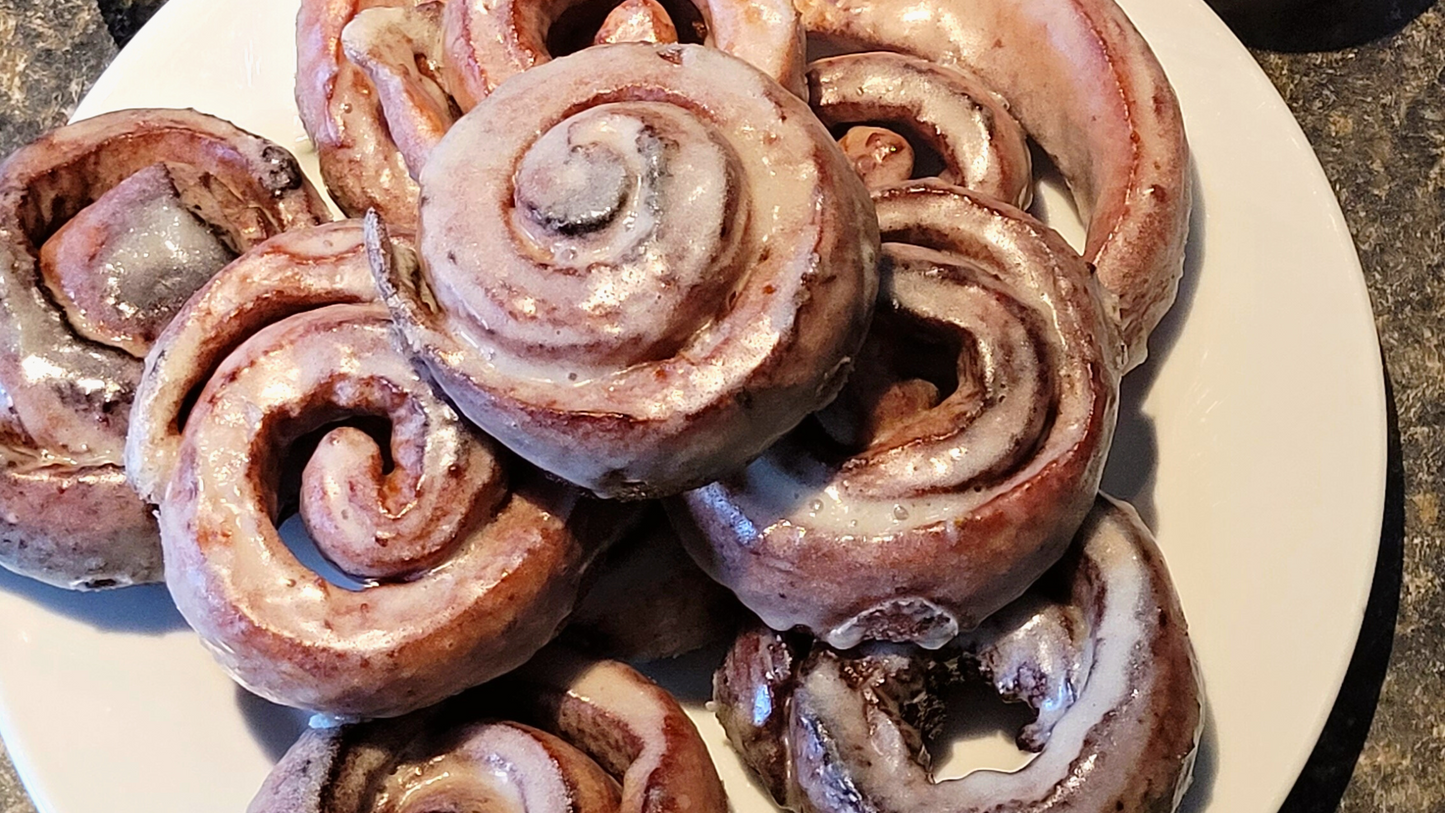 Pile of glazed honeybuns.