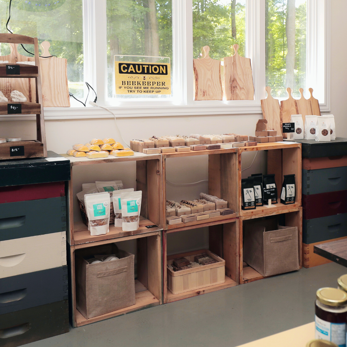 Inside of our on farm store. Hive boxes are used as shelves, displaying soaps and honey.