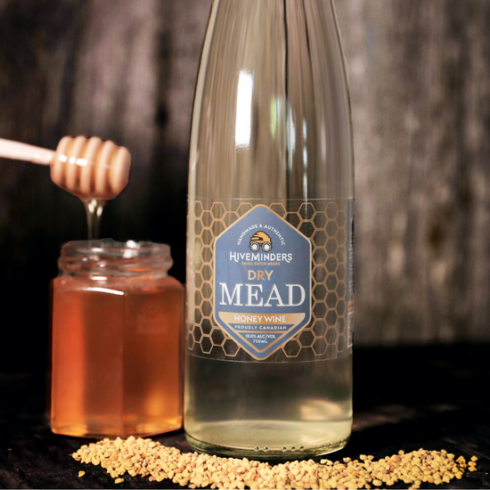 Bottle of Dry Mead with a small jar of honey.